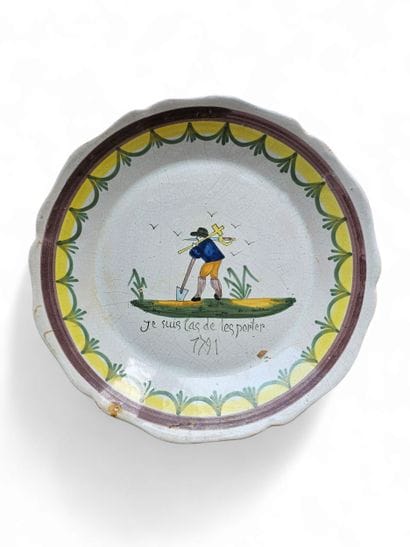 MOUSTIER
Round earthenware plate with yellow...