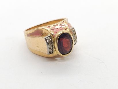 RING in yellow gold 750°, set with a garnet...