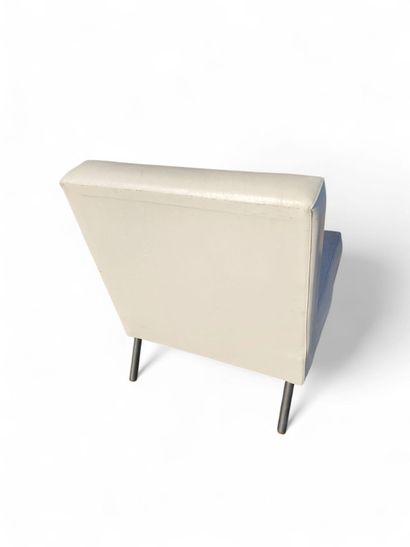 An armchair with a slightly sloping back...