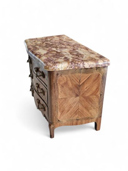 A rosewood and veneer master's chest of drawers...