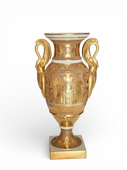 LIMOGES 
A white porcelain baluster vase...