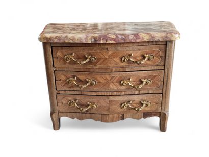 A rosewood and veneer master's chest of drawers...