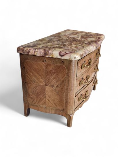 A rosewood and veneer master's chest of drawers...