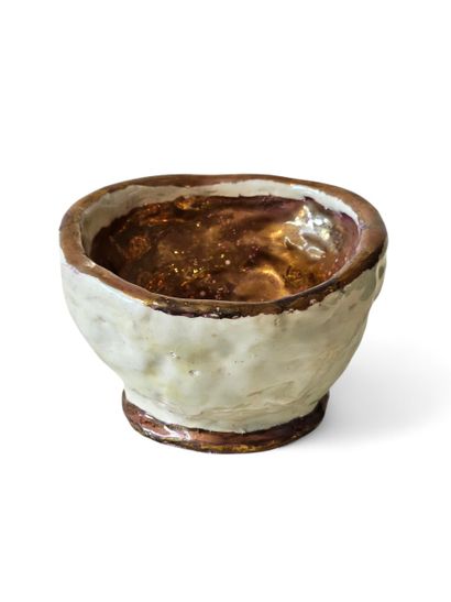 MP 
Cream and gold glazed ceramic pocket...