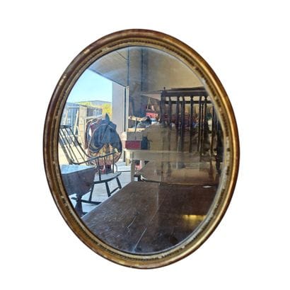 Petit miroir ovale encadrement en bois doré...