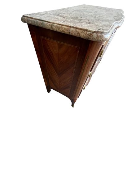 Chest of drawers with a raised panel in curled...