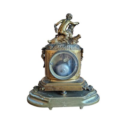 G SCHMOLL
Gilded bronze clock topped with...