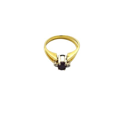 BAGUE en or jaune 750° ornée dans un sens...