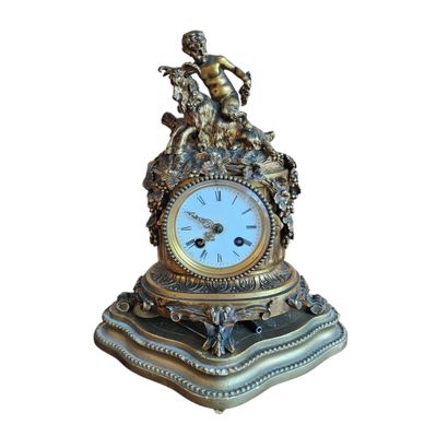 G SCHMOLL
Gilded bronze clock topped with...