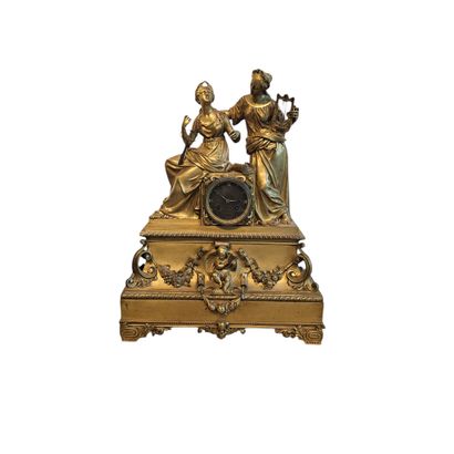 A large gilded bronze clock depicting the...