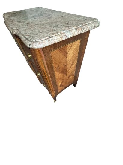 Chest of drawers with a raised panel in curled...