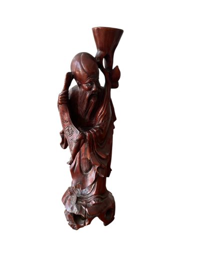 CHINA, 20th century
Carved wooden statuette...