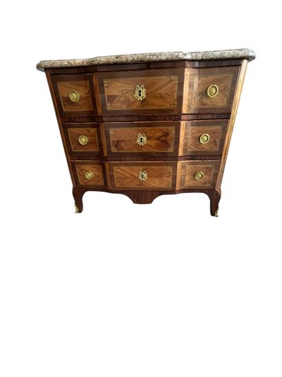 Chest of drawers with a raised panel in curled...