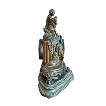 G SCHMOLL
Gilded bronze clock topped with...