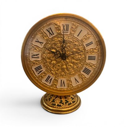 JAEGER 
Circular desk clock in gilded metal...