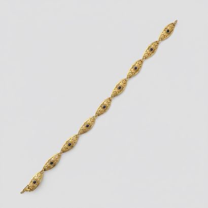 750° yellow gold BRACELET adorned with nine...