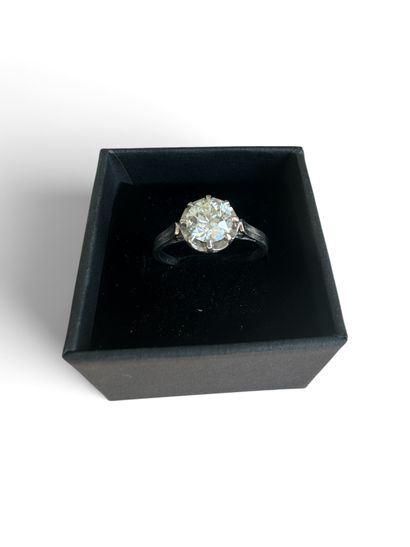 Platinum solitaire ring set with a half-cut...
