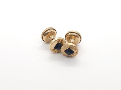 PAIRE de boutons de manchette en métal doré...