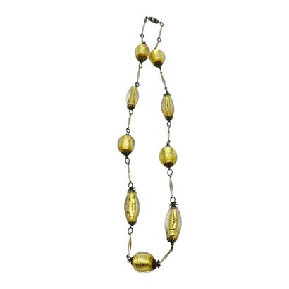 TRAVAIL XXème siècle 
COLLIER en métal doré...