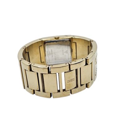 GUESS 
Montre bracelet de dame en métal doré,...