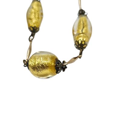 TRAVAIL XXème siècle 
COLLIER en métal doré...