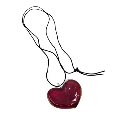 COLLIER sautoir en fil de soie noire accompagnée...