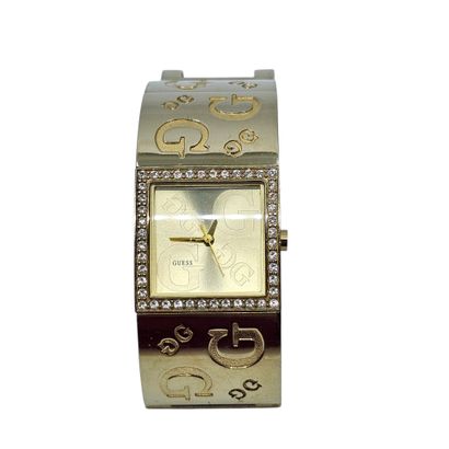 GUESS 
Montre bracelet de dame en métal doré,...