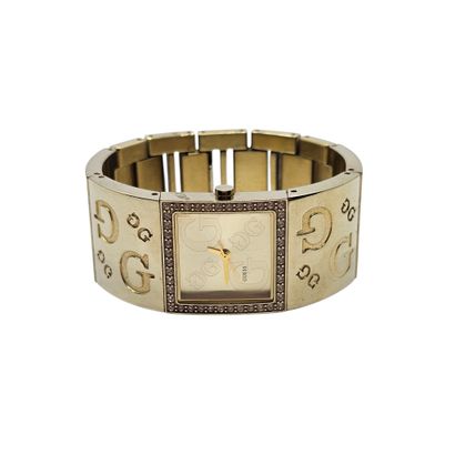 GUESS 
Montre bracelet de dame en métal doré,...