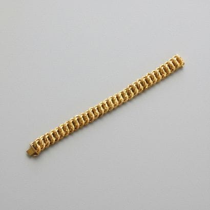 750° yellow gold American-link bracelet 
Weight:...