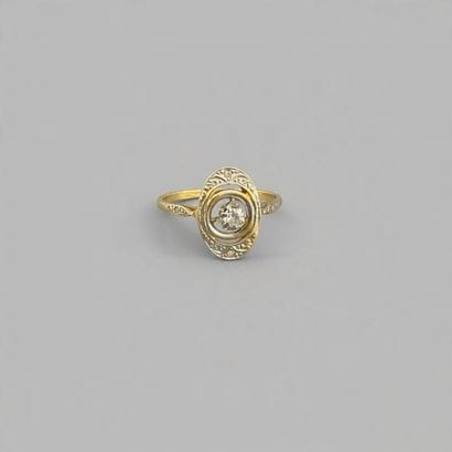 Two-tone gold (.750) ring featuring a diamond...