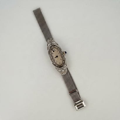 750° white gold watch bracelet, oval case...