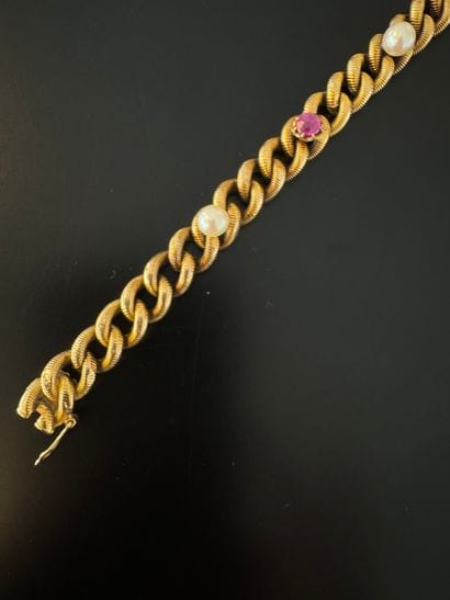 750° yellow gold BRACELET adorned with three...