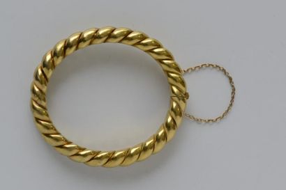 BRACELET jonc torsadé en or jaune 750° ouvrant,...