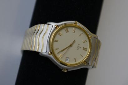 EBEL montre boîtier rond en acier et métal...