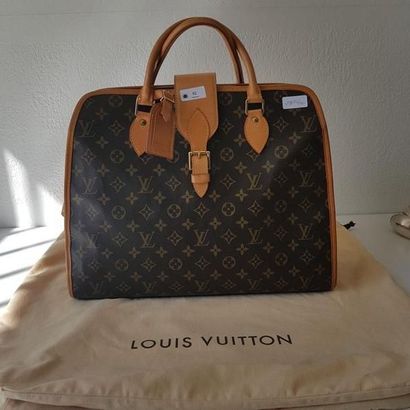VUITTON Louis
Sac à main monogrammée, anses...