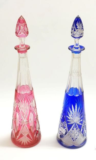 Pair of large carafes and their stoppers,...