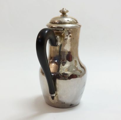 Silver pourer, ebony handle.

Monogrammed...