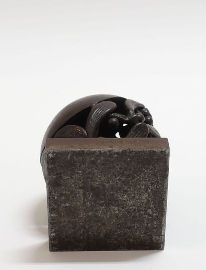 Wrought iron paperweight representing a stylized...