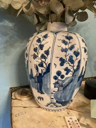 Meeting of two earthenware vases with blue-white...