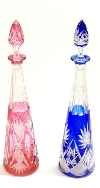 Pair of large carafes and their stoppers,...