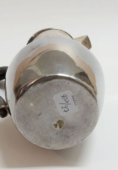 Silver pourer, ebony handle.

Monogrammed...