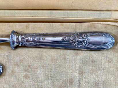A case containing a carving set and a stuffed...
