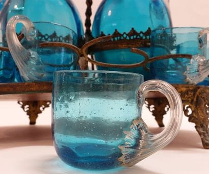 Small liquor set in blue tinted glass including...