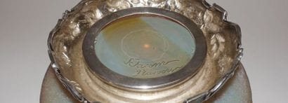 Cup with slightly flattened ovoid belly and...