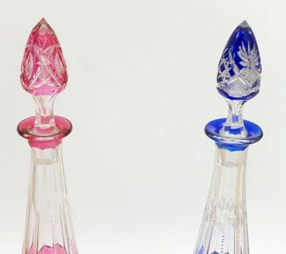 Pair of large carafes and their stoppers,...