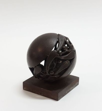 Wrought iron paperweight representing a stylized...