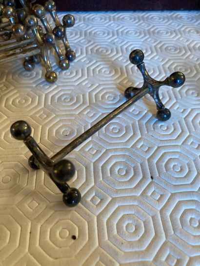 Ten silver plated metal knife holders, cross...