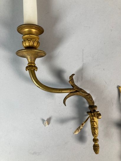 Pair of thin gilt bronze sconces with a light...