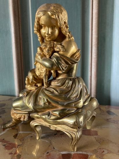 Girl and her dog in gilt bronze. 

19th century....