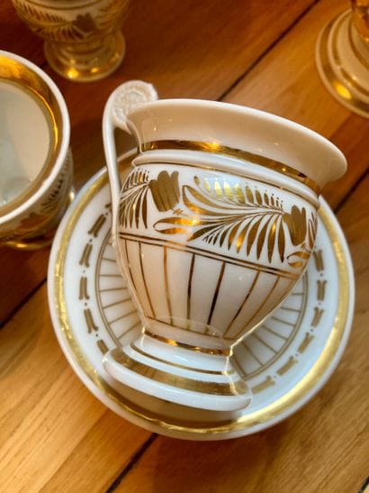 White and gold porcelain service including...